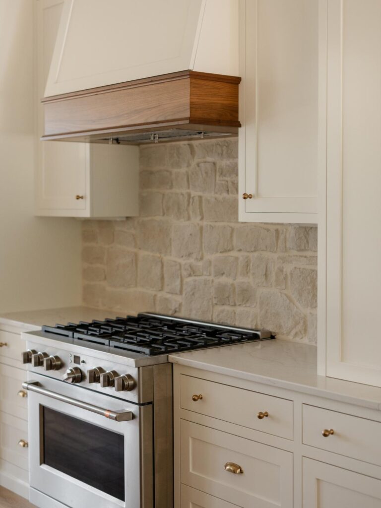 modern farmhouse kitchen with stone backsplash 