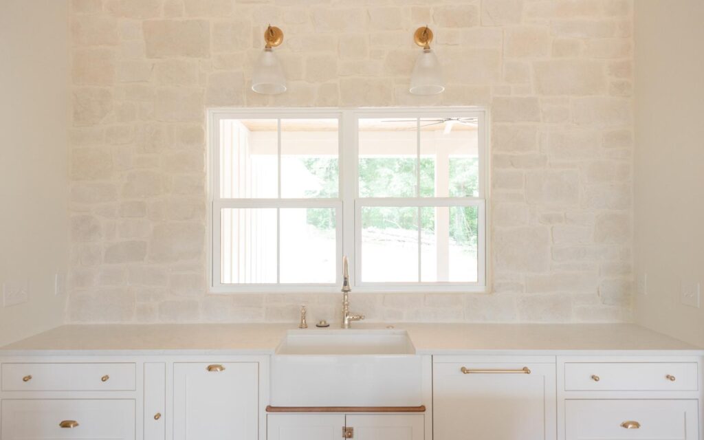 modern farmhouse kitchen with stone wall 